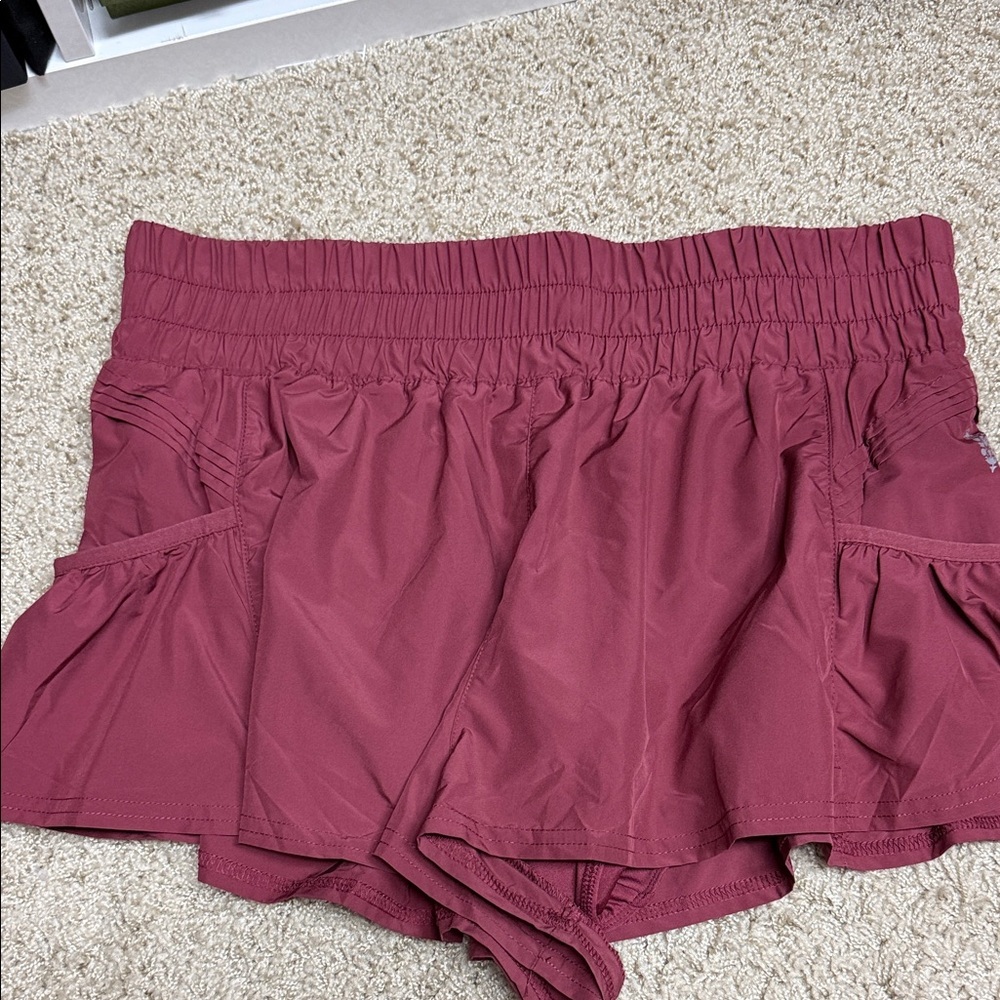 Free people Get your flirt on shorts with pockets.  Size large.  NEVER WORN.